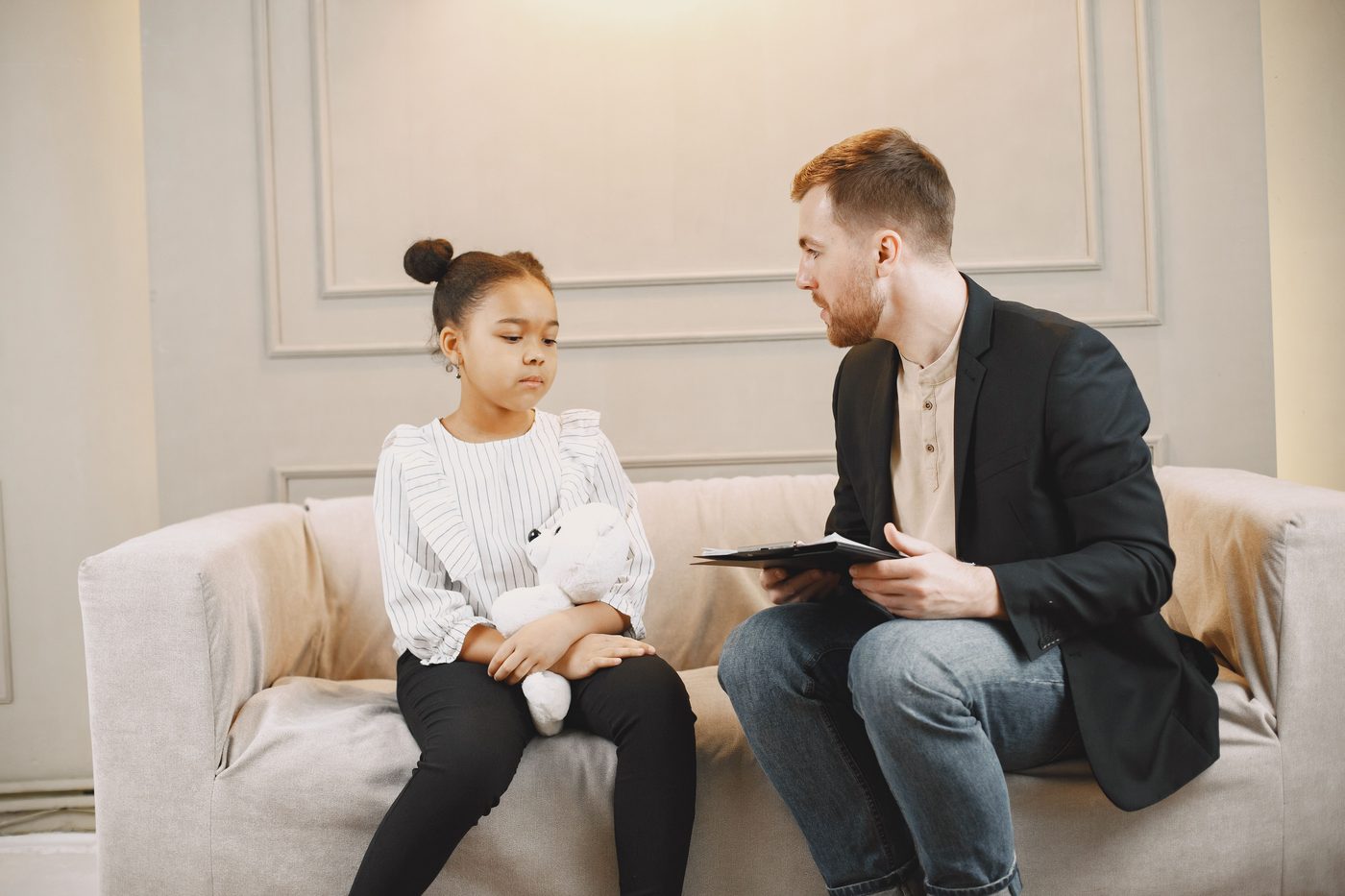 A clinician talking one-on-one with a young client